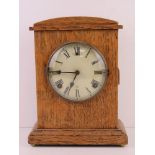 An oak cased mantle clock having white dial marked 'Made in United States of America by WH. L.