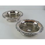 A pair of ornate silver plated wine coasters, 17.5cm dia.
