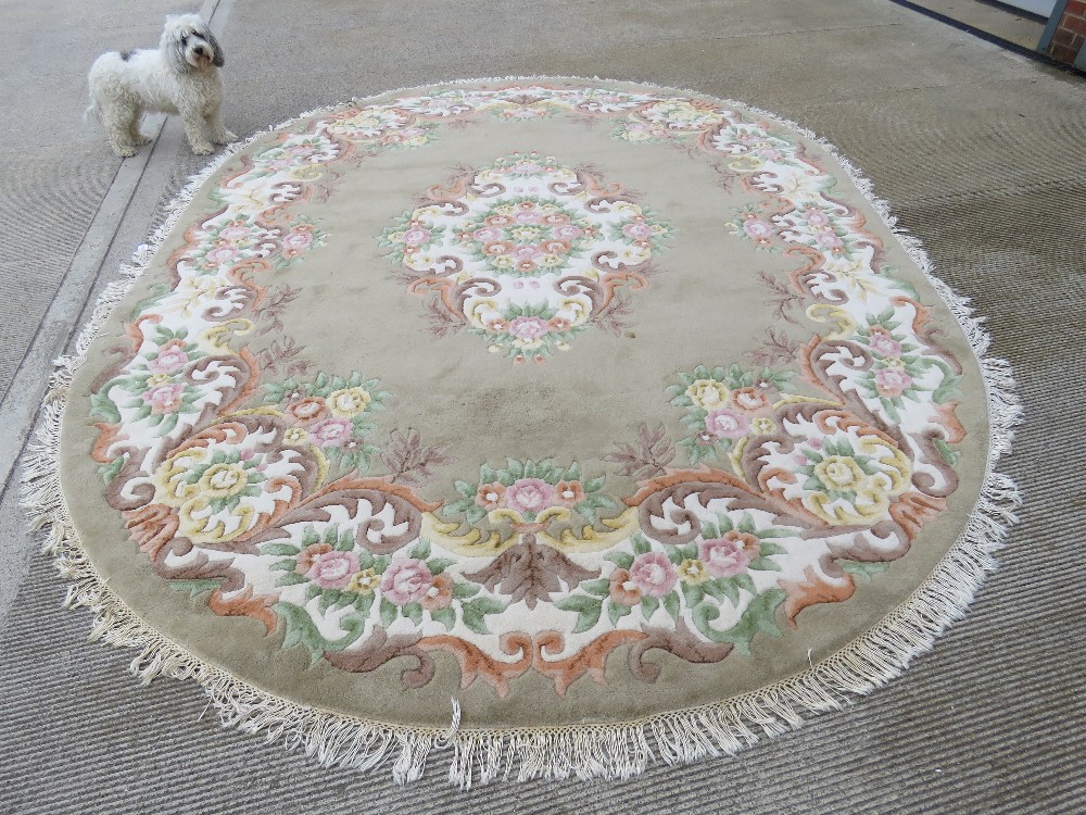 A large oval woolen rug,