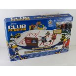 A Disney Club penguin air hockey playset.