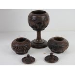 A quantity of hand carved wooden African items inc bowl on triform stand,