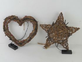 Two decorative whicker work decorative items being a star and a heart,