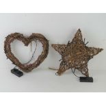 Two decorative whicker work decorative items being a star and a heart,