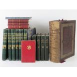 A Victorian leather bound bible together with a quantity of other vintage books.