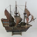A vintage model 'St George' (English Gun Ship) having three masts and rigging, a/f,
