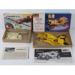 A Fokker E-III Revel scale model kit together with a Highway Classics Hup mobile scale model.