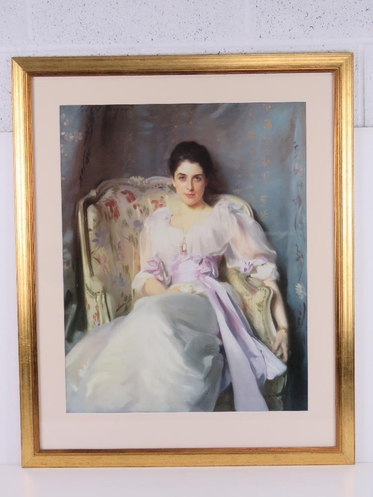 A decorative print of a young lady in white gossamer dress, framed and mounted, overall 70 x 85cm.