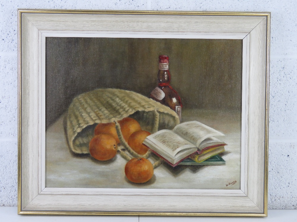 Oil on canvas; still life, books to foreground, basket, fruit and bottle behind, signed H Gooch,