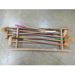 A quantity of wooden croquet mallets.