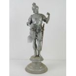An aluminium figure of a knight with brass sword and dagger, slightly a/f 40cm high.
