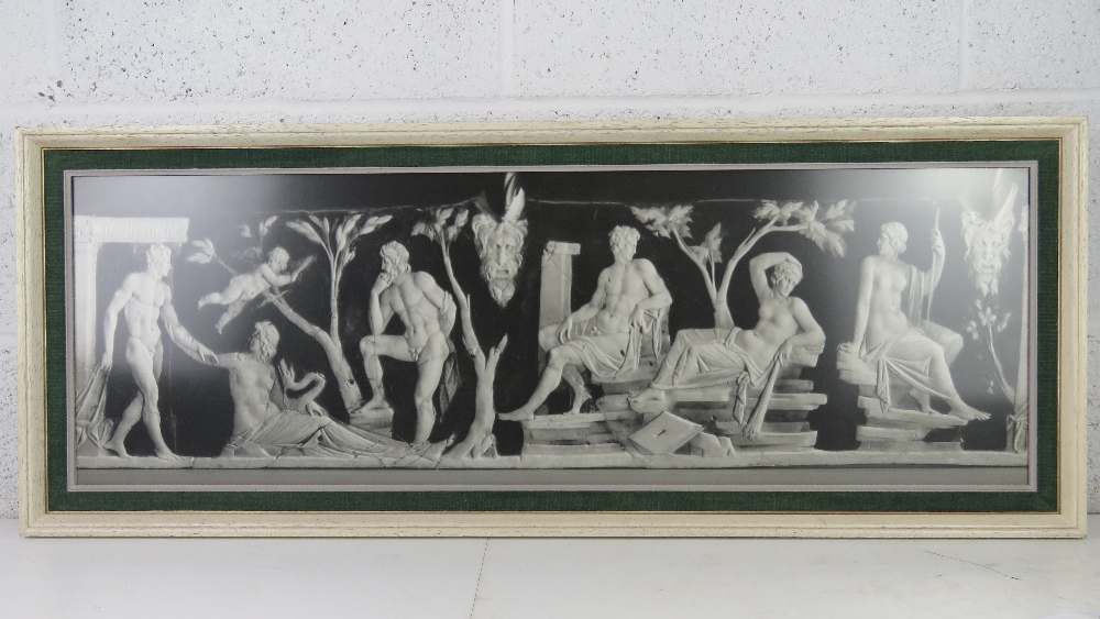 A framed photographic print of a classical marble sculptural scene featuring nude males and females