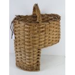 A wicker 'stairs' basket having loop handle over.