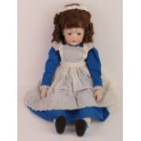 A handmade 20th century bisque headed doll made using an antique doll mould,