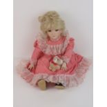 A handmade 20th century bisque headed doll made using an antique doll mould,