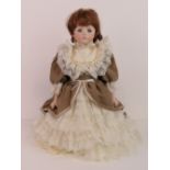 A handmade 20th century bisque headed doll made using an antique doll mould,