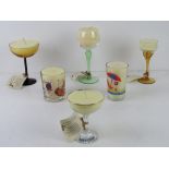 Six assorted handmade candles using vintage coloured glass wine glasses and champagne saucers etc.
