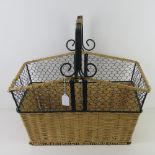 A metal framed wicker basket having loop handle 55 x 36cm