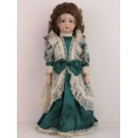 A handmade 20th century bisque headed doll made using an antique doll mould,