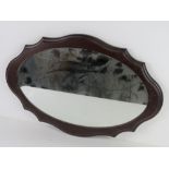 A hanging wall mirror 56 x 37cm overall