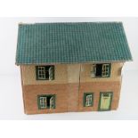A mid to late 20thC dolls house having opening windows and door, some furniture within, 50cm wide.