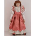 A handmade 20th century bisque headed doll made using an antique doll mould,