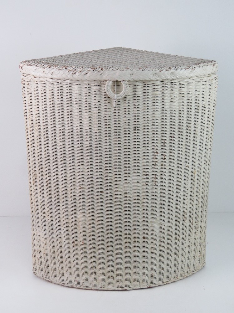 A Lloyd Loom style wicker basket, painted white.