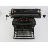 A vintage black painted 'Imperial' typewriter.