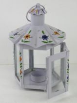 A hand painted well made metal garden 'storm' lantern, approx 23cm not including loop top.