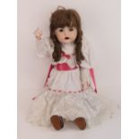 A handmade 20th century bisque headed doll made using an antique doll mould,