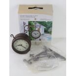 A double sided 'York Station' clock and thermometer, as new in box.