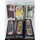 Six contemporary porcelain dolls in boxes.