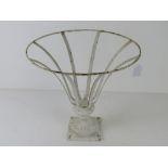 A white painted metal planter stand, 35.5cm dia at widest.