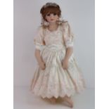 A handmade 20th century bisque headed doll made using an antique doll mould,