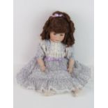 A handmade 20th century bisque headed doll made using an antique doll mould,