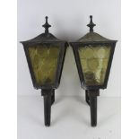 Two black painted metal and glass 'carriage' type wall lanterns a/f.