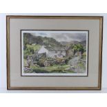 A signed limited edition print of a stone farmhouse with mountains beyond,