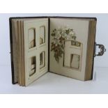 A leather bound and gilded late 19thC / early 20thC photograph album.