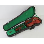 The Stentor Student 1/8 violin in hard case. Bow deficient.