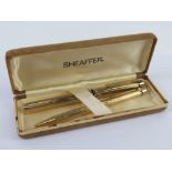 A Shaeffer fountain and ball point pen set, the fountain pen having 14ct gold nib,