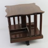 An Edwardian mahogany revolving table top Canterbury bookcase, 38 x 39 x 36cm.