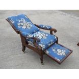 A Victorian mahogany reclining chair with pull out footrest,