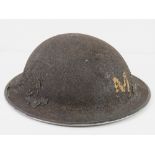 A WWII helmet in original unrestored condition.
