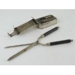 A pair of vintage hair curling tongs complete with spirit heater.