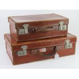 A pair of graduated pigskin leather vintage suitcases,
