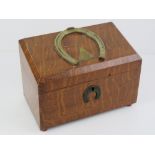 A mahogany letter box having brass horse shoe design to top and escutcheon plate,