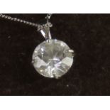 A 9ct white gold diamonique pendant and chain.