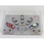 A limited edition display of Audi 1996 Rally race winning model cars by Minichamps in perspex
