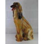 A life size ceramic figurine of an Afghan Hound, Italian made, sitting 82cm high.