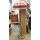 A gold painted standard lamp with silk floral shade upon, all standing 176cm high,