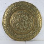 A Persian style brass charger / tabletop 61cm dia.